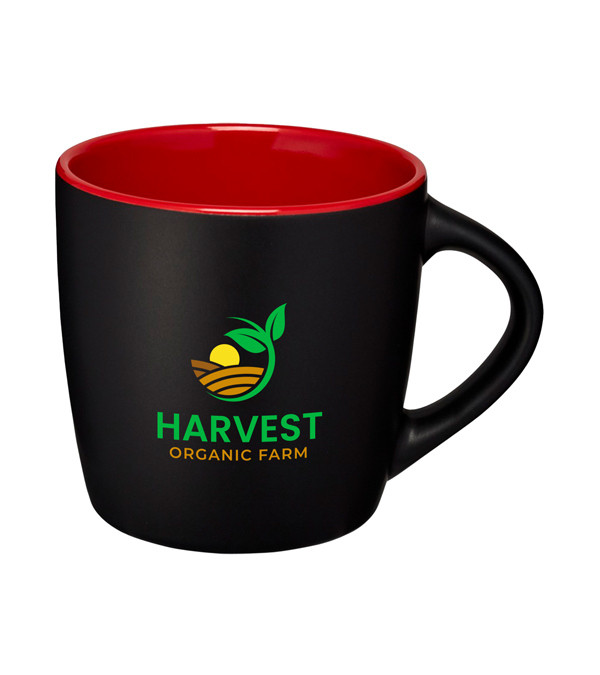 Coffee being poured into a branded matte ceramic mug with a 340ml capacity and enjoyed in an office setting. Durable promotional mug for hot drinks, ideal for corporate branding.